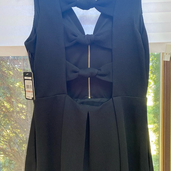 A “Must Have” Black Mini-Dress by Guess - Picture 4 of 6